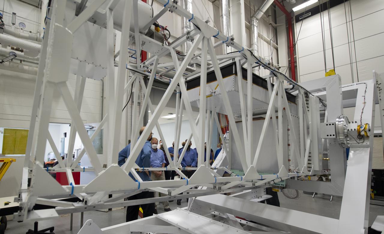 NASA Administrator Bill Nelson is seen through the structure of the Wallops Arc Second Pointer balloon payload being assembled in the Small Satellites, Balloon Research and Development Lab, Tuesday, Aug. 10, 2021, at NASA’s Wallops Flight Facility in Virginia.  Photo Credit: (NASA/Joel Kowsky)