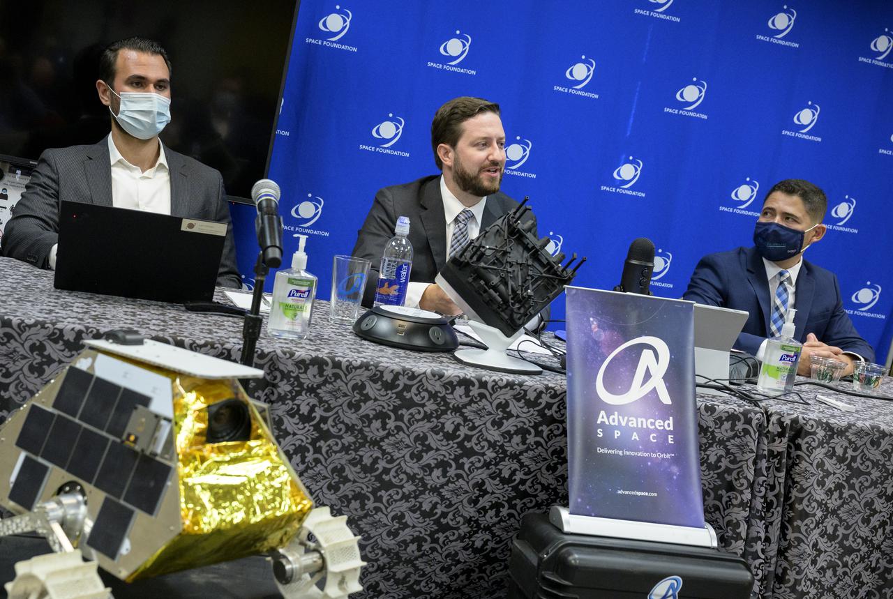 Justin Cyrus, CEO, Lunar Outpost of Golden, Colorado, left, Bradley Cheetham, CEO and president, Advanced Space of Westminster, Colorado, center, and Dr. Luis Zea, implementation project manager, BioServe Space Technologies, Smead Aerospace Engineering Sciences, University of Colorado Boulder, Monday, are seen during a media briefing where NASA Administrator Bill Nelson introduced the three local Colorado companies and university partners that help make NASA’s missions possible, Aug. 23, 2021, during the 36th Space Symposium in Colorado Springs, Colorado. Photo Credit: (NASA/Bill Ingalls)