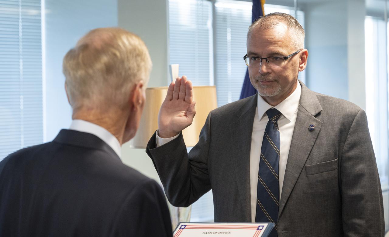 NASA Administrator Bill Nelson, left, swears in Jim Free as the first associate administrator of the new Exploration Systems Development Mission Directorate, Monday, Sept. 20, 2021, at the Mary W. Jackson NASA Headquarters building in Washington. NASA is working to establish ESDMD to focus on planning and developing future space systems while a new Space Operations Mission Directorate will focus on operations. Both areas will support NASA’s Moon to Mars exploration approach. Photo Credit: NASA/Joel Kowsky)
