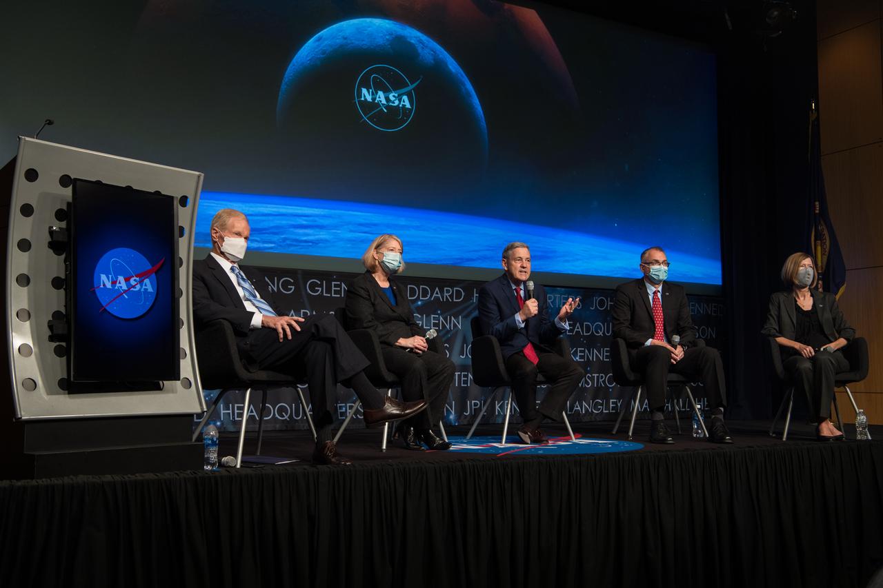 Panelists are seen from left to right, NASA Administrator Bill Nelson; NASA Deputy Administrator Pam Melroy; NASA Associate Administrator Bob Cabana; NASA Associate Administrator for the Exploration Systems Development Mission Directorate (ESDMD), Jim Free; and NASA Associate Administrator for the Space Operations Mission Directorate (SpaceOps), Kathy Lueders, during a NASA town hall to discuss the reorganization of the Human Exploration and Operations Mission Directorate into two mission directorates: ESDMD and SpaceOps, Tuesday, Sept. 21, 2021 at the Mary W. Jackson NASA Headquarters building in Washington. Kathy Lueders will lead SpaceOps in launch and space operations including the International Space Station, the commercialization of low-Earth orbit, and eventually operations on and around the Moon. Jim Free will lead ESDMD to define and manage systems development for programs critical to NASA’s Artemis program and in the planning of NASA’s Moon to Mars exploration. Photo Credit: (NASA/Aubrey Gemignani)