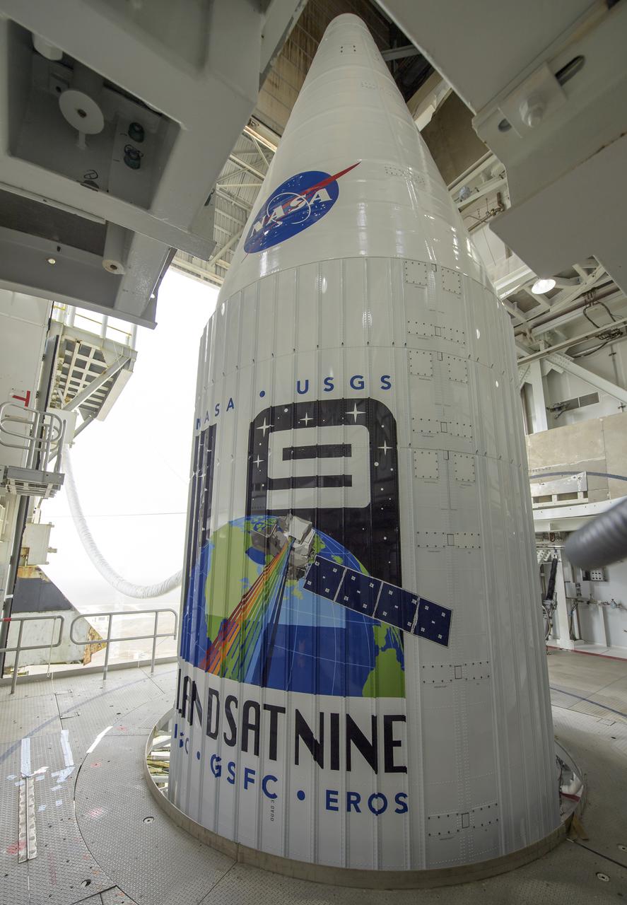 The United Launch Alliance (ULA) Atlas V rocket with the Landsat 9 satellite onboard is seen, Saturday, Sept. 25, 2021, at Vandenberg Space Force Base in California. The Landsat 9 satellite, a joint NASA/U.S. Geological Survey mission that will continue the legacy of monitoring Earth’s land and coastal regions, is scheduled for liftoff Monday, Sept. 27. Photo Credit: (NASA/Bill Ingalls)