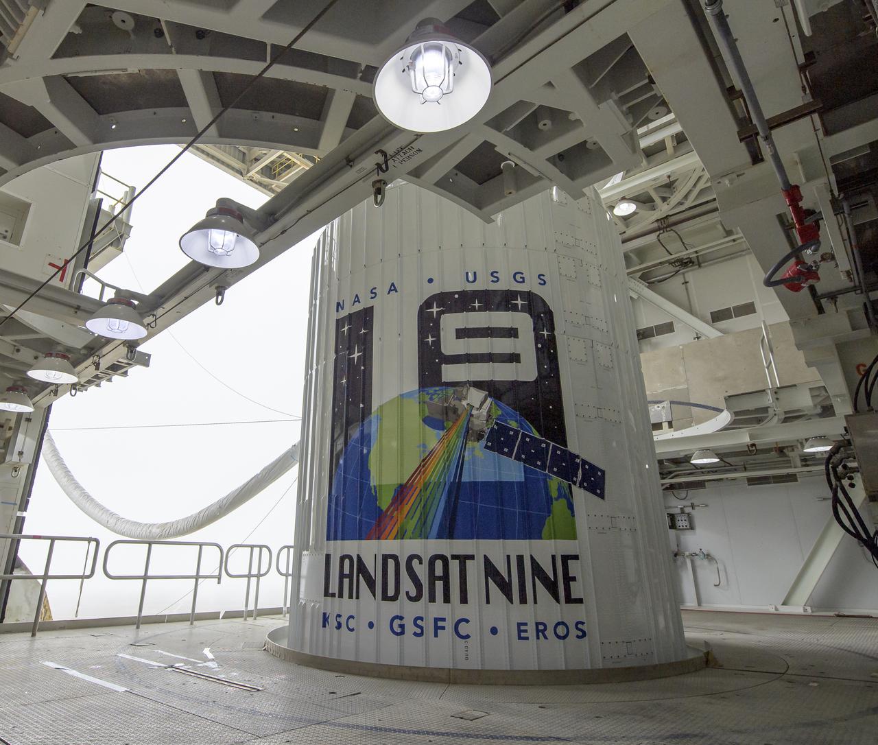 The United Launch Alliance (ULA) Atlas V rocket with the Landsat 9 satellite onboard is seen, Saturday, Sept. 25, 2021, at Vandenberg Space Force Base in California. The Landsat 9 satellite, a joint NASA/U.S. Geological Survey mission that will continue the legacy of monitoring Earth’s land and coastal regions, is scheduled for liftoff Monday, Sept. 27. Photo Credit: (NASA/Bill Ingalls)