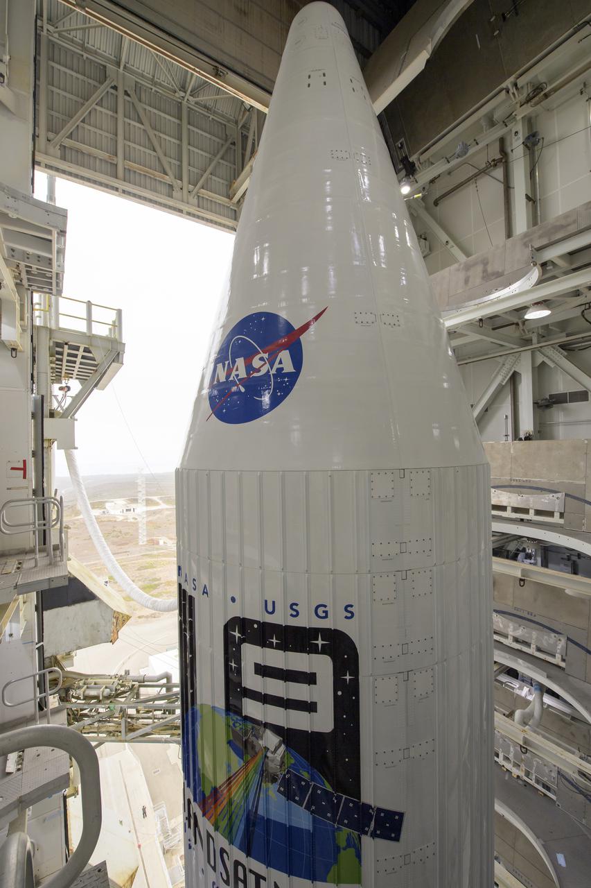 The United Launch Alliance (ULA) Atlas V rocket with the Landsat 9 satellite onboard is seen, Sunday, Sept. 26, 2021, at Vandenberg Space Force Base in California. The Landsat 9 satellite, a joint NASA/U.S. Geological Survey mission that will continue the legacy of monitoring Earth’s land and coastal regions, is scheduled for liftoff Monday, Sept. 27. Photo Credit: (NASA/Bill Ingalls)