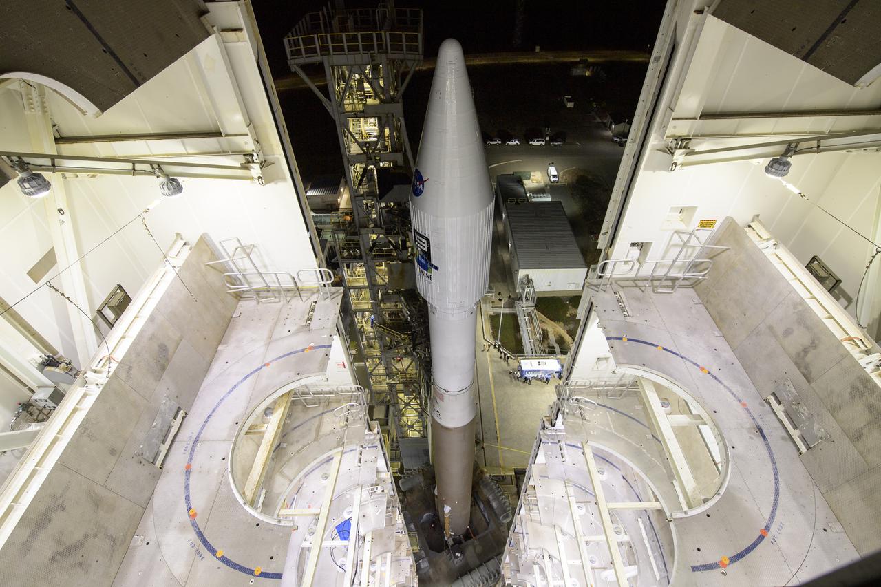 The United Launch Alliance (ULA) Atlas V rocket with the Landsat 9 satellite onboard is seen, Monday, Sept. 27, 2021, as the mobile launcher platform (MLP) is rolled back at Vandenberg Space Force Base in California. The Landsat 9 satellite is a joint NASA/U.S. Geological Survey mission that will continue the legacy of monitoring Earth’s land and coastal regions. Photo Credit: (NASA/Bill Ingalls)