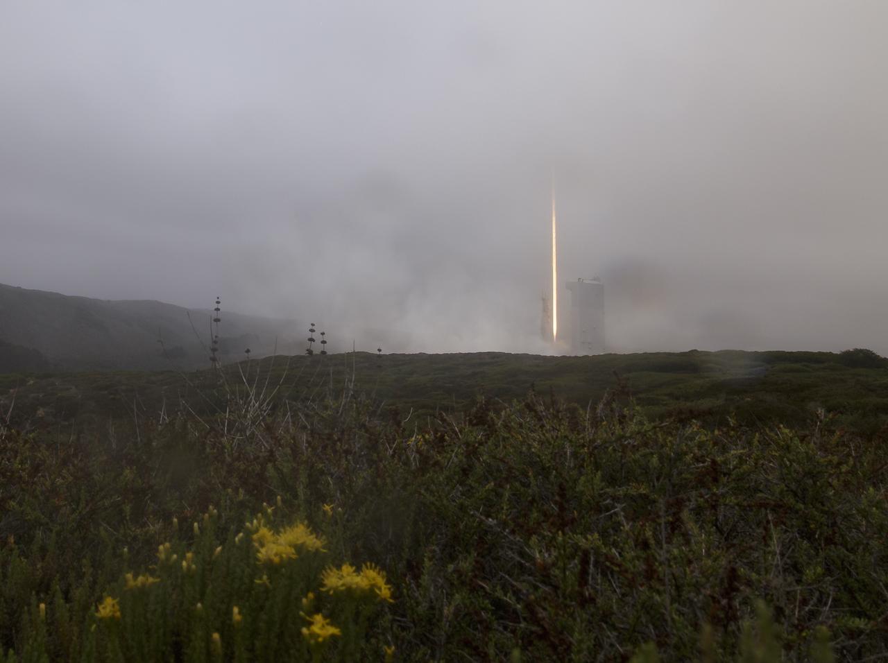 The United Launch Alliance (ULA) Atlas V rocket with the Landsat 9 satellite onboard is seen in this 30 second exposure as is launches, Monday, Sept. 27, 2021, from Space Launch Complex 3 at Vandenberg Space Force Base in California. The Landsat 9 satellite is a joint NASA/U.S. Geological Survey mission that will continue the legacy of monitoring Earth’s land and coastal regions. Photo Credit: (NASA/Bill Ingalls)