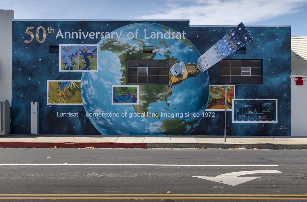 A mural celebrating the 50 years of the Landsat mission is seen, Tuesday, Sept. 28, 2021, in Lompoc, California. On Monday, Sept. 27, 2021, the Landsat 9 satellite, a joint NASA/U.S. Geological Survey mission that will continue the legacy of monitoring Earth’s land and coastal regions, launched from Vandenberg Space Force Base, California. Photo Credit: (NASA/Bill Ingalls)