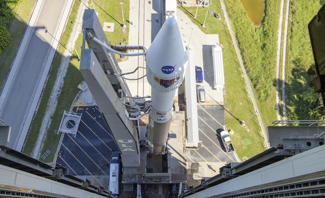 A United Launch Alliance Atlas V rocket with the Lucy spacecraft aboard is seen as it is rolled out of the Vertical Integration Facility to the launch pad at Space Launch Complex 41, Thursday, Oct. 14, 2021, at Cape Canaveral Space Force Station in Florida. Lucy will be the first spacecraft to study Jupiter's Trojan Asteroids. Like the mission's namesake – the fossilized human ancestor, "Lucy," whose skeleton provided unique insight into humanity's evolution – Lucy will revolutionize our knowledge of planetary origins and the formation of the solar system. Photo Credit: (NASA/Bill Ingalls)