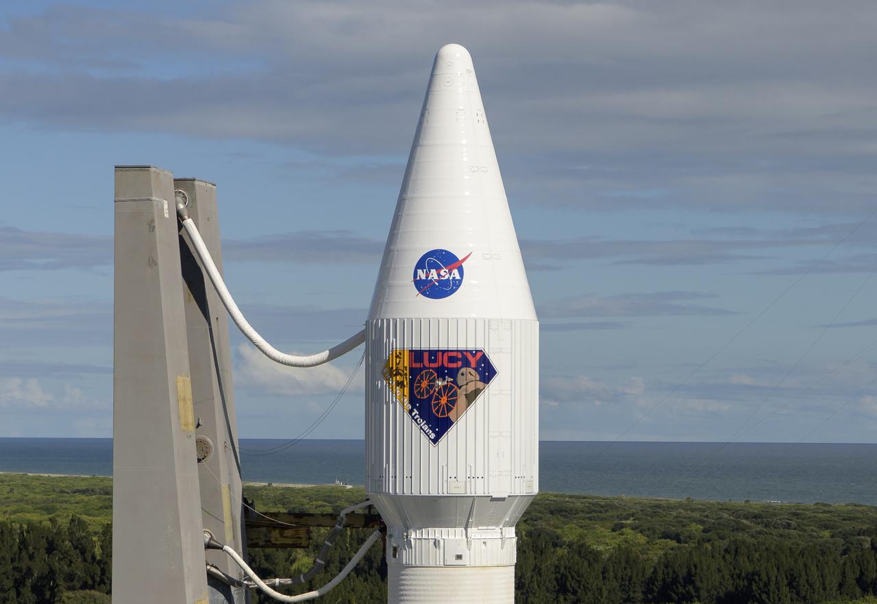 A United Launch Alliance Atlas V rocket with the Lucy spacecraft aboard is seen as it is rolled out of the Vertical Integration Facility to the launch pad at Space Launch Complex 41, Thursday, Oct. 14, 2021, at Cape Canaveral Space Force Station in Florida. Lucy will be the first spacecraft to study Jupiter's Trojan Asteroids. Like the mission's namesake – the fossilized human ancestor, "Lucy," whose skeleton provided unique insight into humanity's evolution – Lucy will revolutionize our knowledge of planetary origins and the formation of the solar system. Photo Credit: (NASA/Bill Ingalls)
