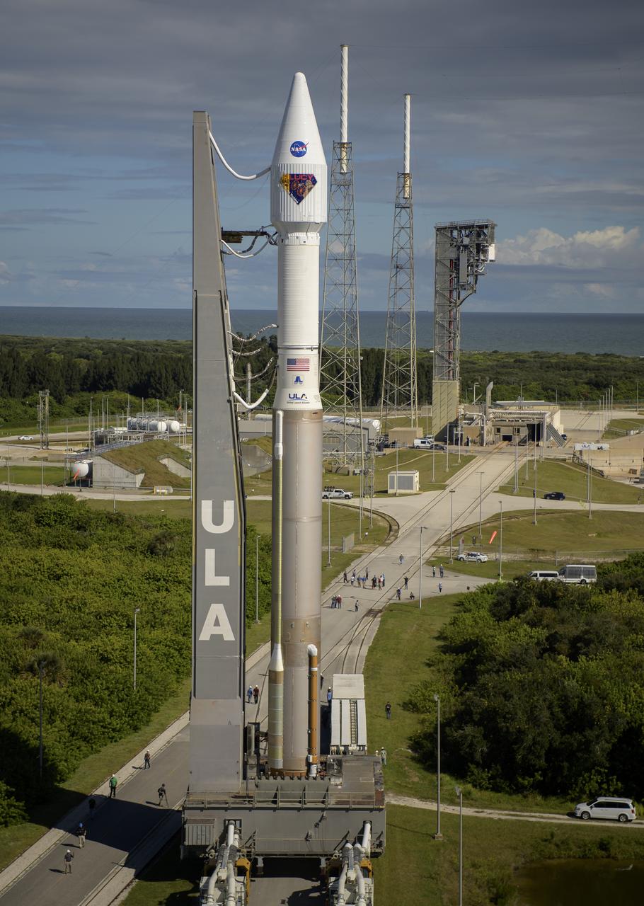 A United Launch Alliance Atlas V rocket with the Lucy spacecraft aboard is seen as it is rolled out of the Vertical Integration Facility to the launch pad at Space Launch Complex 41, Thursday, Oct. 14, 2021, at Cape Canaveral Space Force Station in Florida. Lucy will be the first spacecraft to study Jupiter's Trojan Asteroids. Like the mission's namesake – the fossilized human ancestor, "Lucy," whose skeleton provided unique insight into humanity's evolution – Lucy will revolutionize our knowledge of planetary origins and the formation of the solar system. Photo Credit: (NASA/Bill Ingalls)