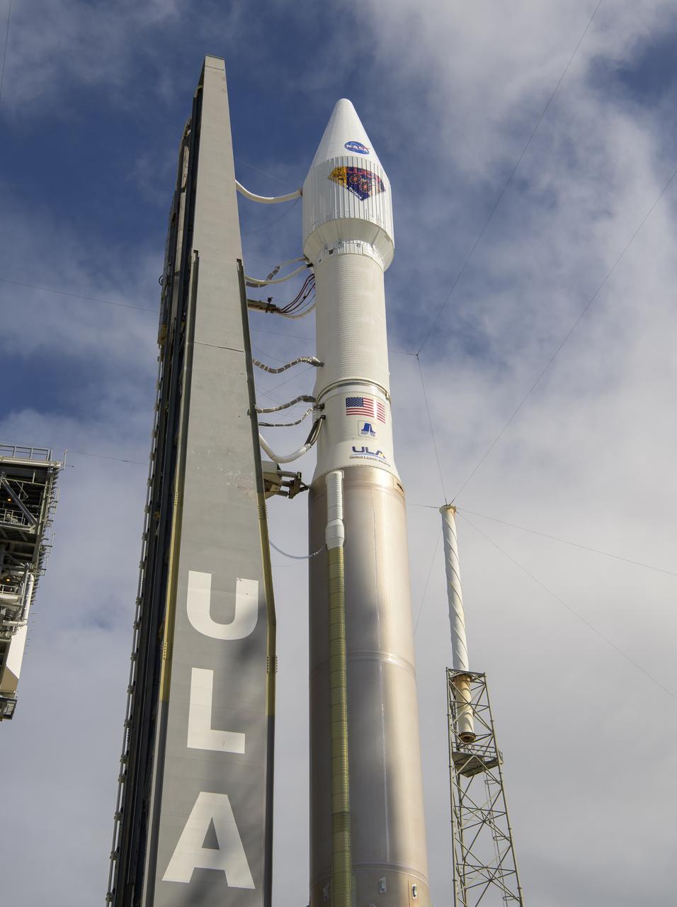 A United Launch Alliance Atlas V rocket with the Lucy spacecraft aboard is seen as it is rolled out of the Vertical Integration Facility to the launch pad at Space Launch Complex 41, Thursday, Oct. 14, 2021, at Cape Canaveral Space Force Station in Florida. Lucy will be the first spacecraft to study Jupiter's Trojan Asteroids. Like the mission's namesake – the fossilized human ancestor, "Lucy," whose skeleton provided unique insight into humanity's evolution – Lucy will revolutionize our knowledge of planetary origins and the formation of the solar system. Photo Credit: (NASA/Bill Ingalls)