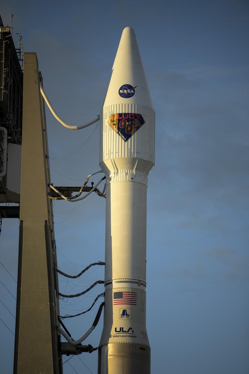 A United Launch Alliance Atlas V rocket with the Lucy spacecraft aboard is seen at Space Launch Complex 41, Thursday, Oct. 14, 2021, at Cape Canaveral Space Force Station in Florida. Lucy will be the first spacecraft to study Jupiter's Trojan Asteroids. Like the mission's namesake – the fossilized human ancestor, "Lucy," whose skeleton provided unique insight into humanity's evolution – Lucy will revolutionize our knowledge of planetary origins and the formation of the solar system. Photo Credit: (NASA/Bill Ingalls)