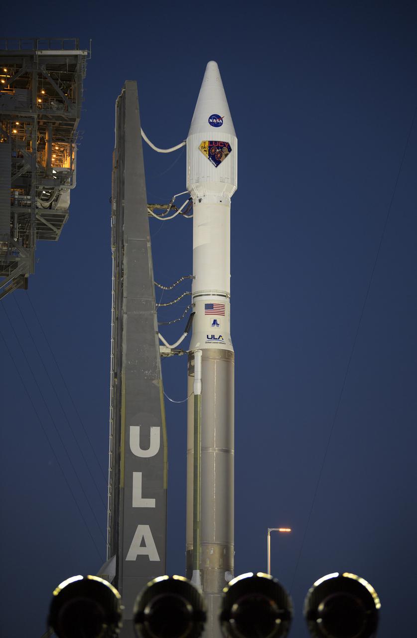 A United Launch Alliance Atlas V rocket with the Lucy spacecraft aboard is seen at Space Launch Complex 41, Thursday, Oct. 14, 2021, at Cape Canaveral Space Force Station in Florida. Lucy will be the first spacecraft to study Jupiter's Trojan Asteroids. Like the mission's namesake – the fossilized human ancestor, "Lucy," whose skeleton provided unique insight into humanity's evolution – Lucy will revolutionize our knowledge of planetary origins and the formation of the solar system. Photo Credit: (NASA/Bill Ingalls)