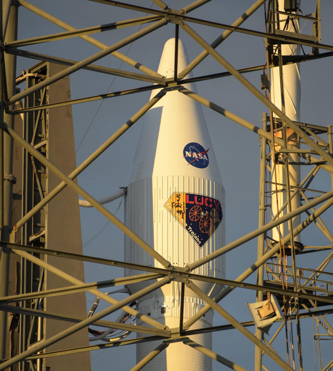 A United Launch Alliance Atlas V rocket with the Lucy spacecraft aboard is seen at Space Launch Complex 41, Thursday, Oct. 14, 2021, at Cape Canaveral Space Force Station in Florida. Lucy will be the first spacecraft to study Jupiter's Trojan Asteroids. Like the mission's namesake – the fossilized human ancestor, "Lucy," whose skeleton provided unique insight into humanity's evolution – Lucy will revolutionize our knowledge of planetary origins and the formation of the solar system. Photo Credit: (NASA/Bill Ingalls)