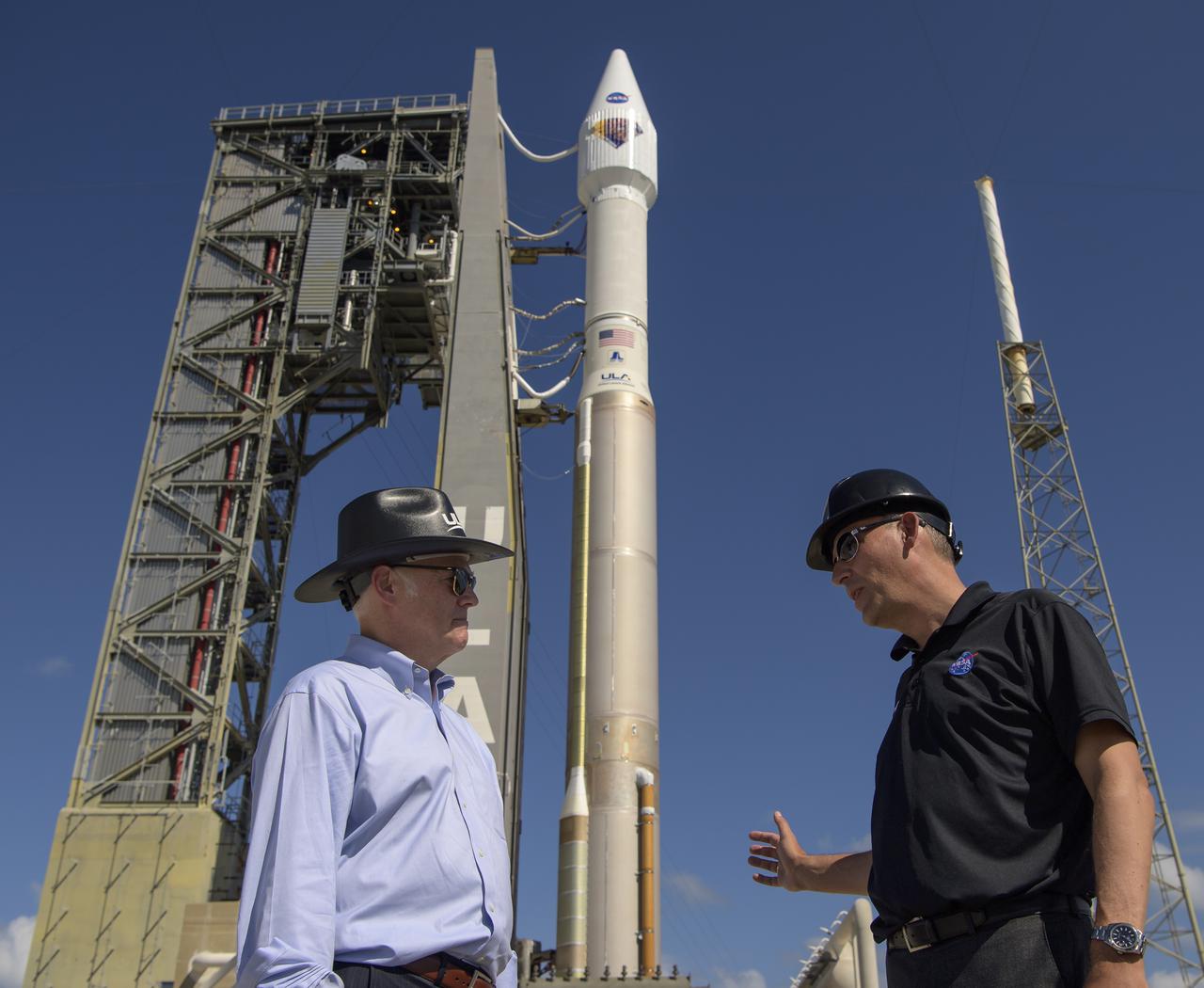 President and CEO United Launch AllianceTory Bruno, left, and NASA Associate Administrator for Science Thomas Zurbuchen meet at the base of the United Launch Alliance Atlas V rocket with the Lucy spacecraft aboard at Space Launch Complex 41, Friday, Oct. 15, 2021, at Cape Canaveral Space Force Station in Florida. Lucy will be the first spacecraft to study Jupiter's Trojan Asteroids. Like the mission's namesake – the fossilized human ancestor, "Lucy," whose skeleton provided unique insight into humanity's evolution – Lucy will revolutionize our knowledge of planetary origins and the formation of the solar system. Photo Credit: (NASA/Bill Ingalls)