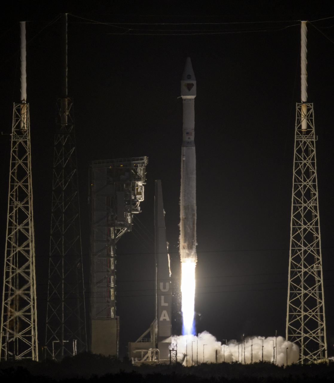 A United Launch Alliance Atlas V rocket with the Lucy spacecraft aboard launches from Space Launch Complex 41, Saturday, Oct. 16, 2021, at Cape Canaveral Space Force Station in Florida. Lucy will be the first spacecraft to study Jupiter's Trojan Asteroids. Like the mission's namesake – the fossilized human ancestor, "Lucy," whose skeleton provided unique insight into humanity's evolution – Lucy will revolutionize our knowledge of planetary origins and the formation of the solar system. Photo Credit: (NASA/Bill Ingalls)