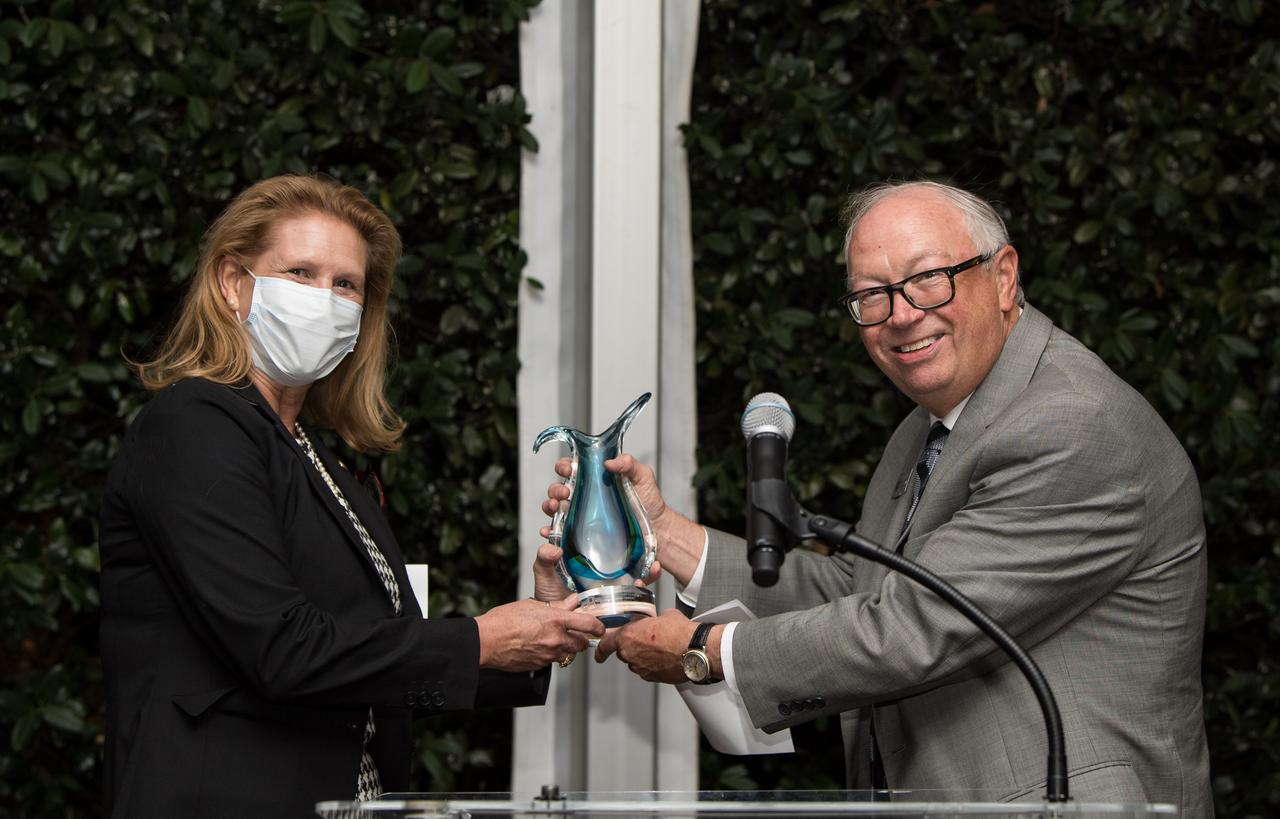 Director of the NASA Science Mission Directorate’s Planetary Science Division, Dr. Lori Glaze, left, accepts the Lifetime Achievement Award on behalf of the agency from director of the National Museum of Nuclear Science and History, Jim Walther, during the Nuclear Science Week event, Tuesday, Oct. 19, 2021, at The Observatory at America’s Square in Washington. Photo Credit: (NASA/Aubrey Gemignani)