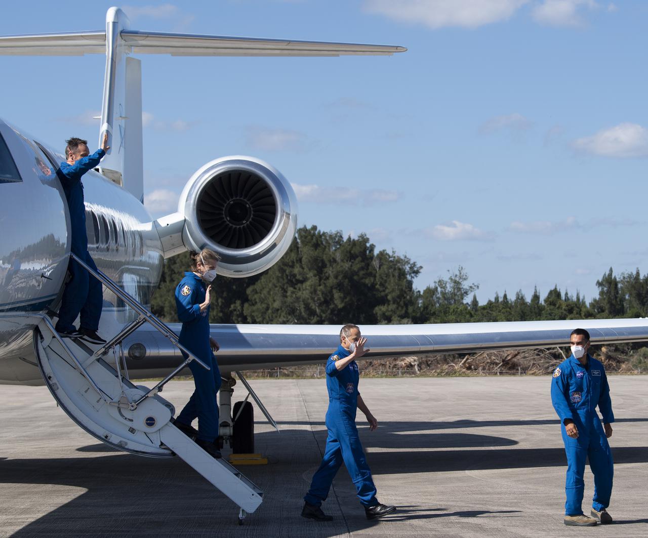 NASA astronauts Raja Chari, right, Tom Marshburn, second from right, Kayla Barron, second from left, and ESA (European Space Agency) astronaut Matthias Maurer, left, are seen as they arrive from Houston at the Launch and Landing Facility at NASA’s Kennedy Space Center ahead of SpaceX’s Crew-3 mission, Tuesday, Oct. 26, 2021, in Florida. NASA’s SpaceX Crew-3 mission is the third crew rotation mission of the SpaceX Crew Dragon spacecraft and Falcon 9 rocket to the International Space Station as part of the agency’s Commercial Crew Program. Chari, Marshburn, Barron, Maurer are scheduled to launch at Oct. 31 at 2:21 a.m. ET, from Launch Complex 39A at the Kennedy Space Center. Photo Credit: (NASA/Joel Kowsky)