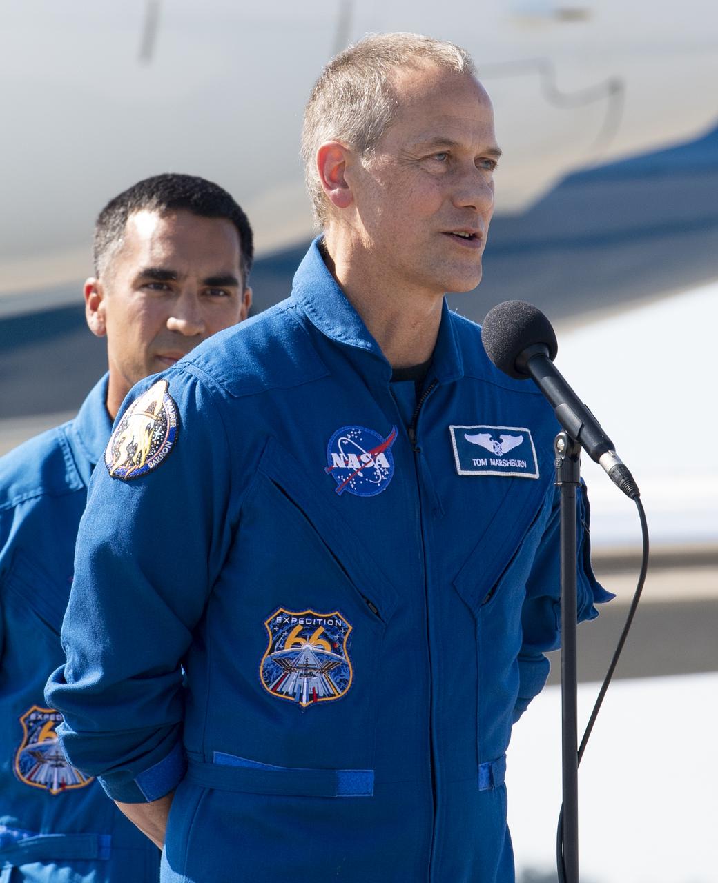 NASA astronaut Tom Marshburn speaks to members of the media after arriving from Houston at the Launch and Landing Facility at NASA’s Kennedy Space Center with fellow NASA astronauts Kayla Barron and Raja Chari, and ESA (European Space Agency) astronaut Matthias Maurer ahead of SpaceX’s Crew-3 mission, Tuesday, Oct. 26, 2021, in Florida. NASA’s SpaceX Crew-3 mission is the third crew rotation mission of the SpaceX Crew Dragon spacecraft and Falcon 9 rocket to the International Space Station as part of the agency’s Commercial Crew Program. Chari, Marshburn, Barron, Maurer are scheduled to launch at Oct. 31 at 2:21 a.m. ET, from Launch Complex 39A at the Kennedy Space Center. Photo Credit: (NASA/Joel Kowsky)