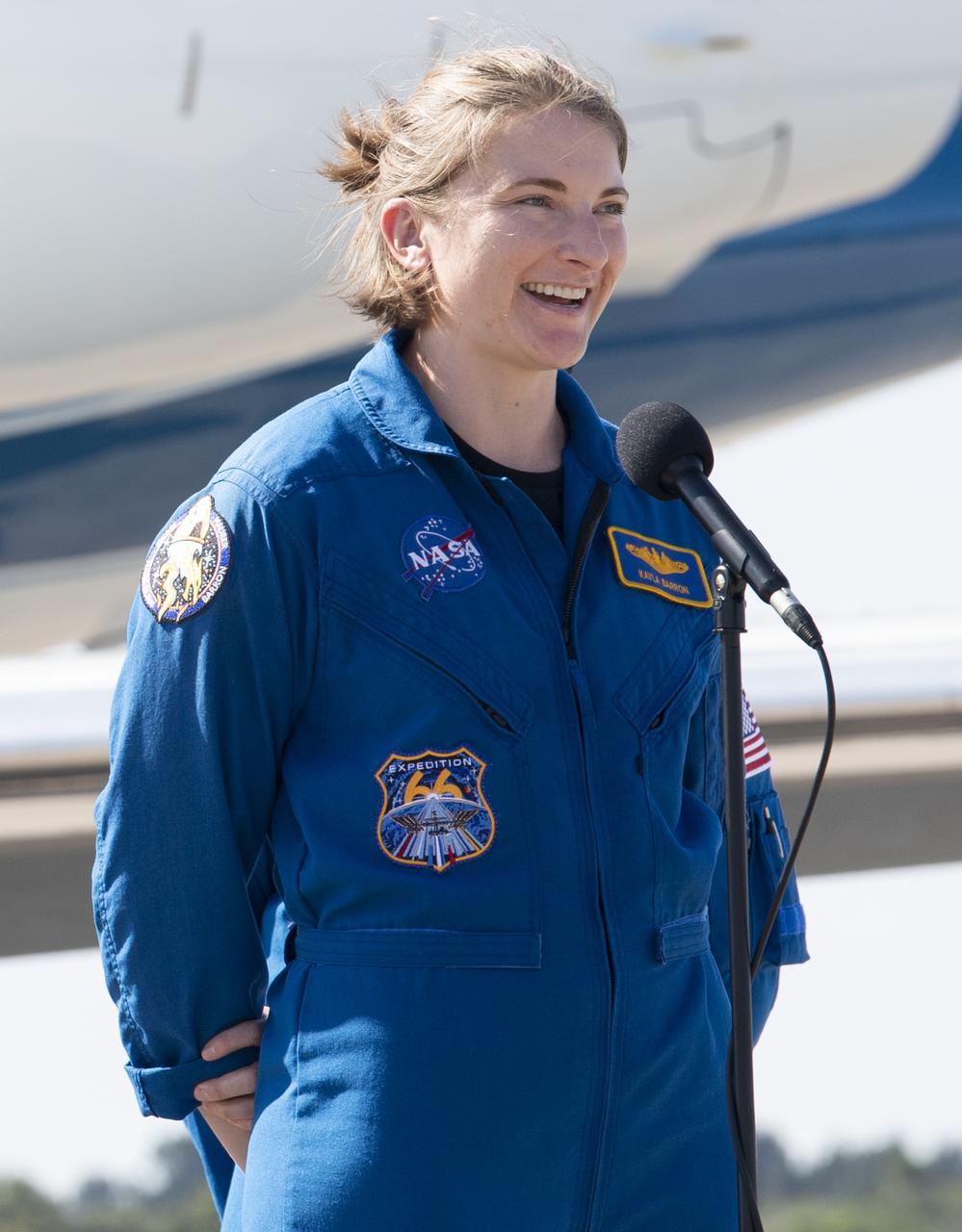 NASA astronauts Kayla Barron speaks to members of the media after arriving from Houston at the Launch and Landing Facility at NASA’s Kennedy Space Center with fellow NASA astronauts Raja Chari and Tom Marshburn and ESA (European Space Agency) astronaut Matthias Maurer ahead of SpaceX’s Crew-3 mission, Tuesday, Oct. 26, 2021, in Florida. NASA’s SpaceX Crew-3 mission is the third crew rotation mission of the SpaceX Crew Dragon spacecraft and Falcon 9 rocket to the International Space Station as part of the agency’s Commercial Crew Program. Chari, Marshburn, Barron, Maurer are scheduled to launch at Oct. 31 at 2:21 a.m. ET, from Launch Complex 39A at the Kennedy Space Center. Photo Credit: (NASA/Joel Kowsky)