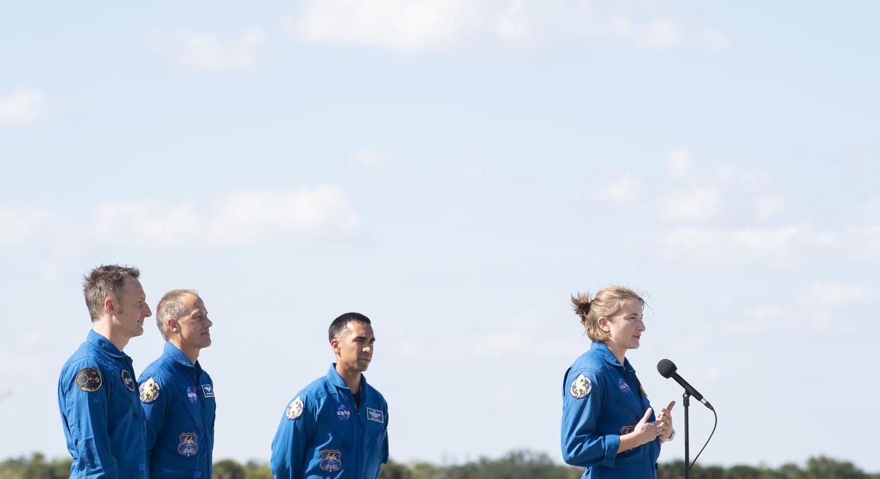 NASA astronauts Kayla Barron speaks to members of the media after arriving from Houston at the Launch and Landing Facility at NASA’s Kennedy Space Center with fellow NASA astronauts Raja Chari and Tom Marshburn and ESA (European Space Agency) astronaut Matthias Maurer ahead of SpaceX’s Crew-3 mission, Tuesday, Oct. 26, 2021, in Florida. NASA’s SpaceX Crew-3 mission is the third crew rotation mission of the SpaceX Crew Dragon spacecraft and Falcon 9 rocket to the International Space Station as part of the agency’s Commercial Crew Program. Chari, Marshburn, Barron, Maurer are scheduled to launch at Oct. 31 at 2:21 a.m. ET, from Launch Complex 39A at the Kennedy Space Center. Photo Credit: (NASA/Joel Kowsky)