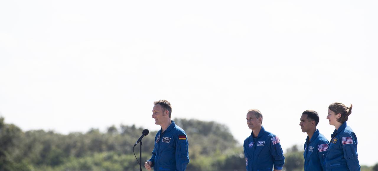ESA (European Space Agency) astronaut Matthias Maurer, left, speaks to members of the media after arriving from Houston at the Launch and Landing Facility at NASA’s Kennedy Space Center with NASA’s astronauts Tom Marshburn, Raja Chari, and Kayla Barron ahead of SpaceX’s Crew-3 mission, Tuesday, Oct. 26, 2021, in Florida. NASA’s SpaceX Crew-3 mission is the third crew rotation mission of the SpaceX Crew Dragon spacecraft and Falcon 9 rocket to the International Space Station as part of the agency’s Commercial Crew Program. Chari, Marshburn, Barron, Maurer are scheduled to launch at Oct. 31 at 2:21 a.m. ET, from Launch Complex 39A at the Kennedy Space Center. Photo Credit: (NASA/Joel Kowsky)