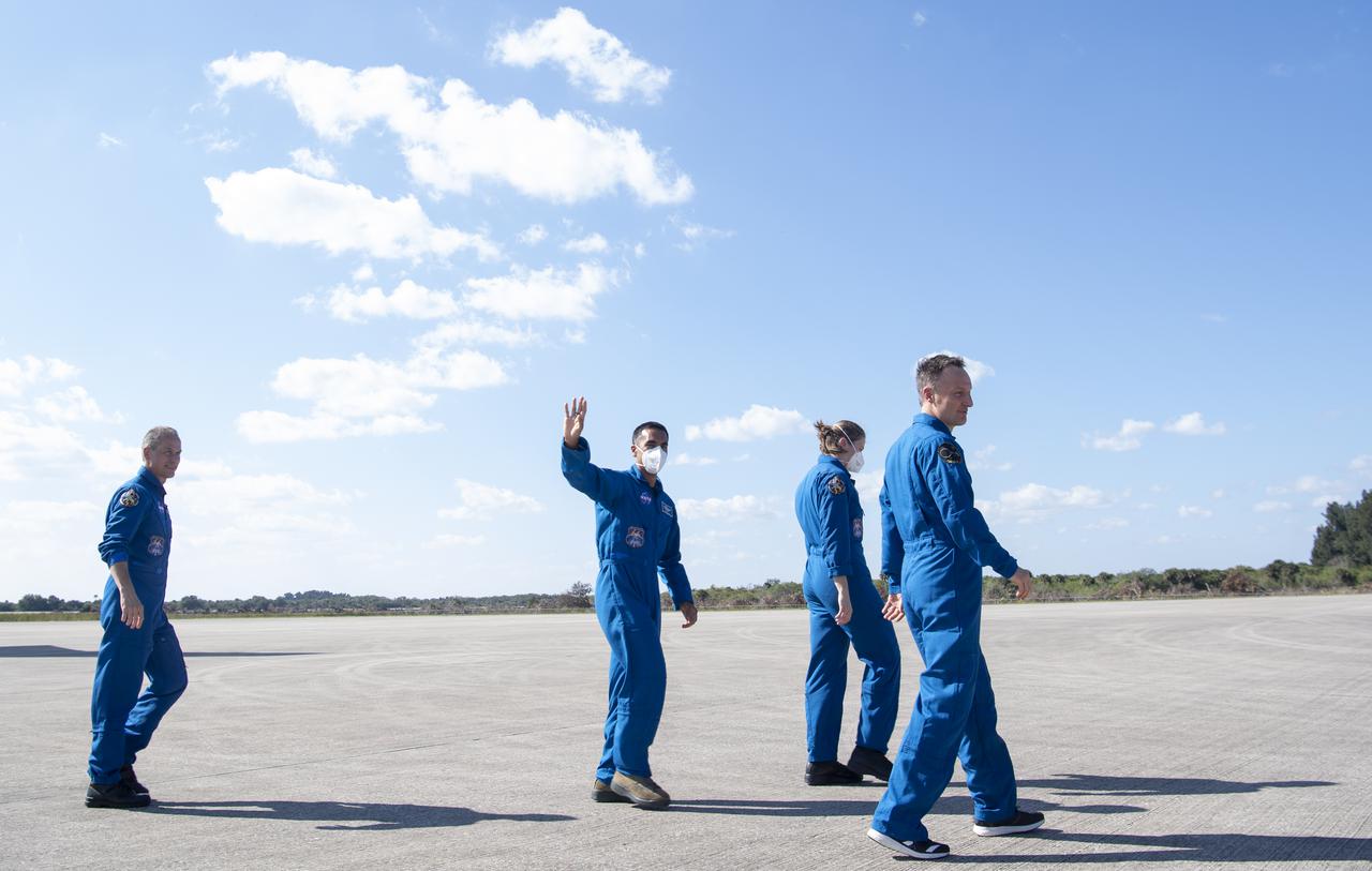 NASA astronauts Tom Marshburn, left, Raja Chari, second from left, Kayla Barron, second from right, and ESA (European Space Agency) astronaut Matthias Maurer, right, are seen as they depart the Landing Facility at NASA’s Kennedy Space Center ahead of SpaceX’s Crew-3 mission, Tuesday, Oct. 26, 2021, in Florida. NASA’s SpaceX Crew-3 mission is the third crew rotation mission of the SpaceX Crew Dragon spacecraft and Falcon 9 rocket to the International Space Station as part of the agency’s Commercial Crew Program. Chari, Marshburn, Barron, Maurer are scheduled to launch at Oct. 31 at 2:21 a.m. ET, from Launch Complex 39A at the Kennedy Space Center. Photo Credit: (NASA/Joel Kowsky)