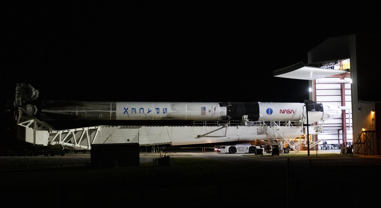 A SpaceX Falcon 9 rocket with the company's Crew Dragon spacecraft onboard is seen as it is rolled out to the launch pad at Launch Complex 39A as preparations continue for the Crew-3 mission, Wednesday, Oct. 27, 2021, at NASA’s Kennedy Space Center in Florida. NASA’s SpaceX Crew-3 mission is the third crew rotation mission of the SpaceX Crew Dragon spacecraft and Falcon 9 rocket to the International Space Station as part of the agency’s Commercial Crew Program. NASA astronauts Raja Chari, Tom Marshburn, Kayla Barron, and ESA (European Space Agency) astronaut Matthias Maurer are scheduled to launch on Oct. 31 at 2:21 a.m. ET, from Launch Complex 39A at the Kennedy Space Center. Photo Credit: (NASA/Joel Kowsky)