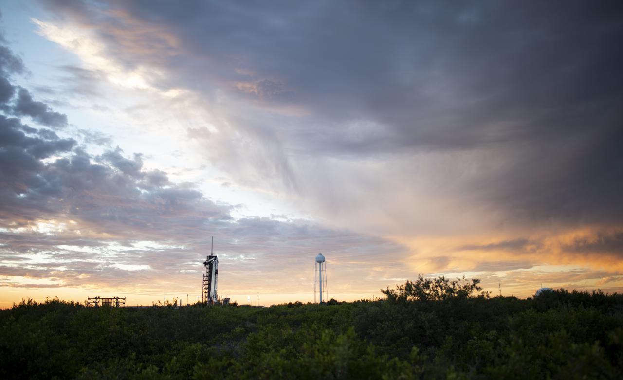 A SpaceX Falcon 9 rocket with the company's Crew Dragon spacecraft onboard is seen at sunset on the launch pad at Launch Complex 39A as preparations continue for the Crew-3 mission, Wednesday, Oct. 27, 2021, at NASA’s Kennedy Space Center in Florida. NASA’s SpaceX Crew-3 mission is the third crew rotation mission of the SpaceX Crew Dragon spacecraft and Falcon 9 rocket to the International Space Station as part of the agency’s Commercial Crew Program. NASA astronauts Raja Chari, Tom Marshburn, Kayla Barron, and ESA (European Space Agency) astronaut Matthias Maurer are scheduled to launch on Oct. 31 at 2:21 a.m. ET, from Launch Complex 39A at the Kennedy Space Center. Photo Credit: (NASA/Joel Kowsky)