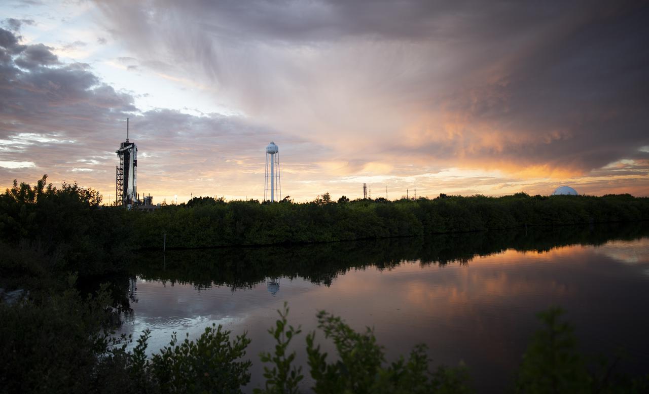 A SpaceX Falcon 9 rocket with the company's Crew Dragon spacecraft onboard is seen at sunset on the launch pad at Launch Complex 39A as preparations continue for the Crew-3 mission, Wednesday, Oct. 27, 2021, at NASA’s Kennedy Space Center in Florida. NASA’s SpaceX Crew-3 mission is the third crew rotation mission of the SpaceX Crew Dragon spacecraft and Falcon 9 rocket to the International Space Station as part of the agency’s Commercial Crew Program. NASA astronauts Raja Chari, Tom Marshburn, Kayla Barron, and ESA (European Space Agency) astronaut Matthias Maurer are scheduled to launch on Oct. 31 at 2:21 a.m. ET, from Launch Complex 39A at the Kennedy Space Center. Photo Credit: (NASA/Joel Kowsky)