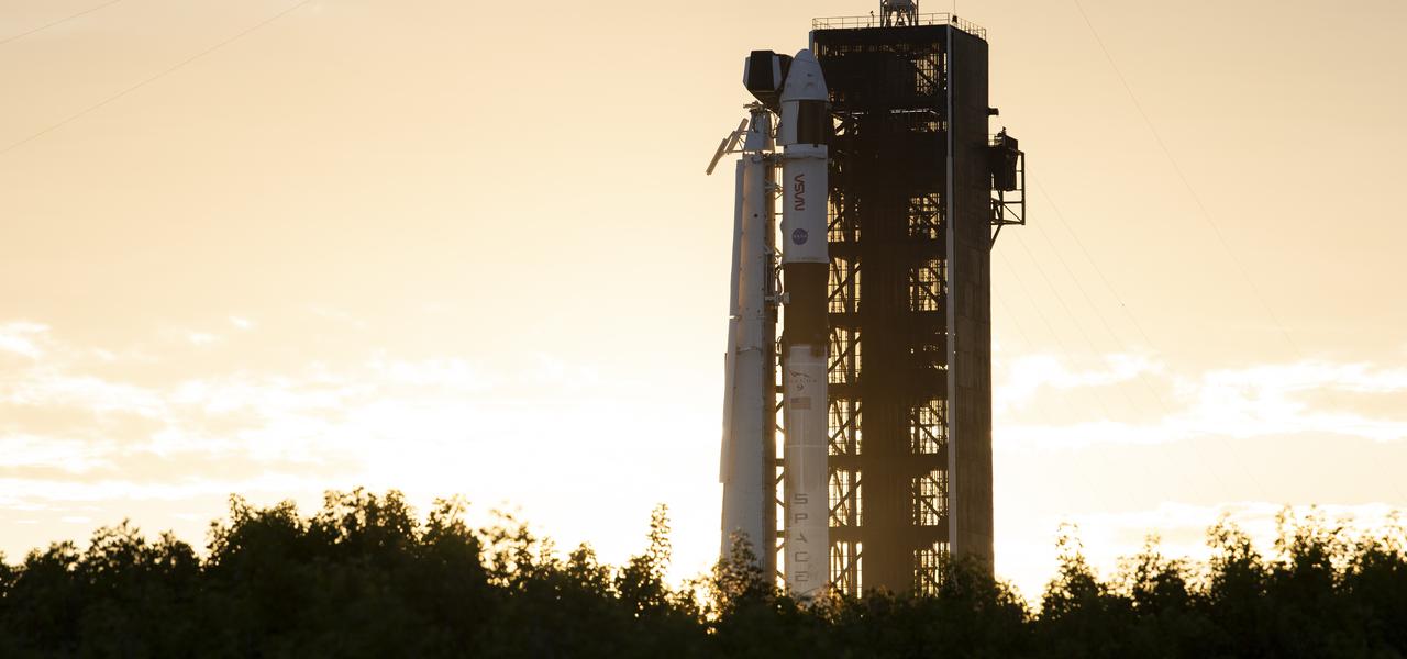 A SpaceX Falcon 9 rocket with the company's Crew Dragon spacecraft onboard is seen at sunset on the launch pad at Launch Complex 39A as preparations continue for the Crew-3 mission, Wednesday, Oct. 27, 2021, at NASA’s Kennedy Space Center in Florida. NASA’s SpaceX Crew-3 mission is the third crew rotation mission of the SpaceX Crew Dragon spacecraft and Falcon 9 rocket to the International Space Station as part of the agency’s Commercial Crew Program. NASA astronauts Raja Chari, Tom Marshburn, Kayla Barron, and ESA (European Space Agency) astronaut Matthias Maurer are scheduled to launch on Oct. 31 at 2:21 a.m. ET, from Launch Complex 39A at the Kennedy Space Center. Photo Credit: (NASA/Joel Kowsky)