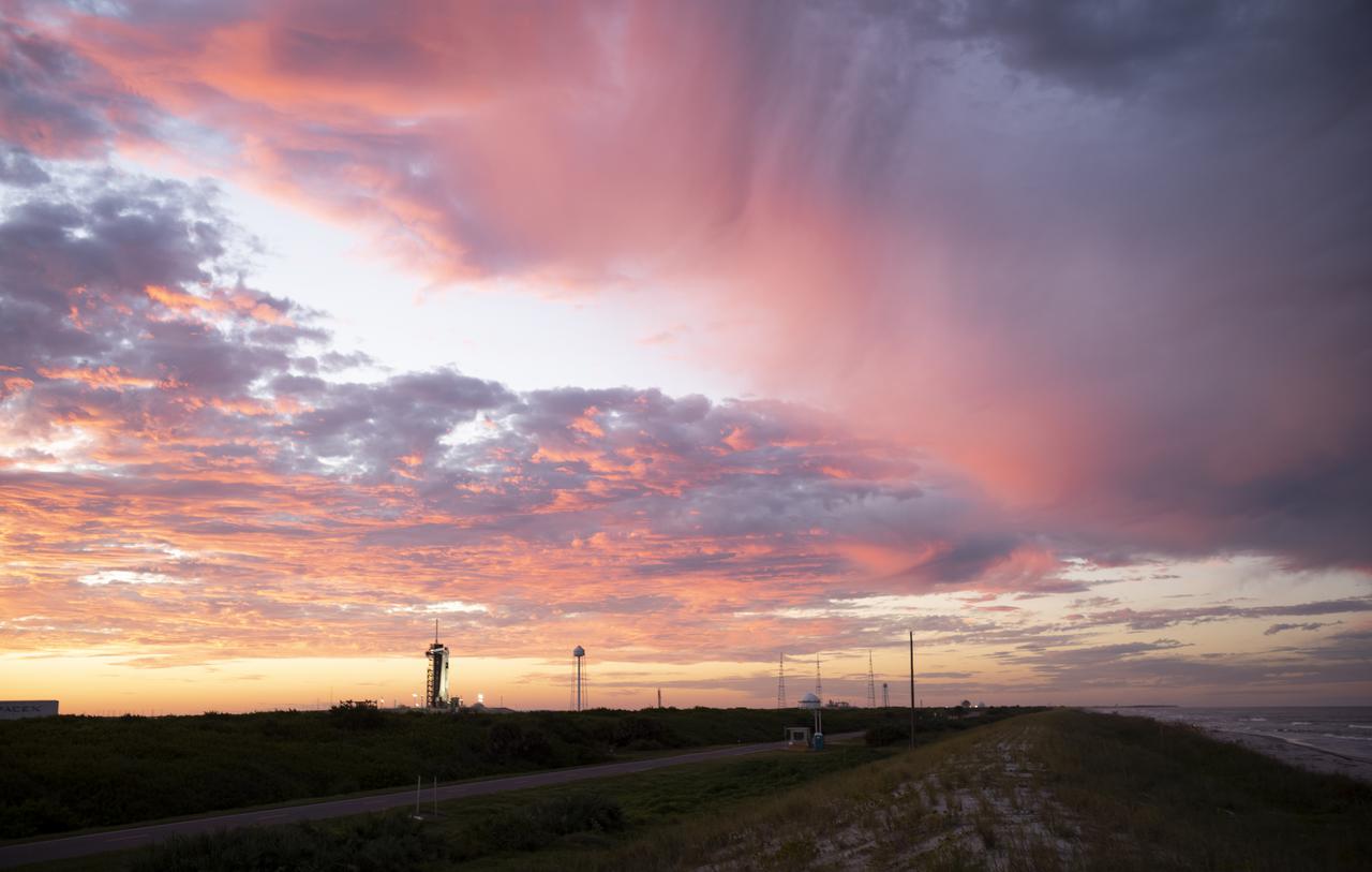 A SpaceX Falcon 9 rocket with the company's Crew Dragon spacecraft onboard is seen at sunset on the launch pad at Launch Complex 39A as preparations continue for the Crew-3 mission, Wednesday, Oct. 27, 2021, at NASA’s Kennedy Space Center in Florida. NASA’s SpaceX Crew-3 mission is the third crew rotation mission of the SpaceX Crew Dragon spacecraft and Falcon 9 rocket to the International Space Station as part of the agency’s Commercial Crew Program. NASA astronauts Raja Chari, Tom Marshburn, Kayla Barron, and ESA (European Space Agency) astronaut Matthias Maurer are scheduled to launch on Oct. 31 at 2:21 a.m. ET, from Launch Complex 39A at the Kennedy Space Center. Photo Credit: (NASA/Joel Kowsky)