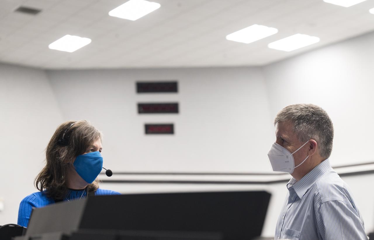 NASA’s chief flight director, Holly Ridings speaks with Steve Stich, manager of NASA’s Commercial Crew Program, during a dress rehearsal in preparation for the launch of a SpaceX Falcon 9 rocket carrying the company's Crew Dragon spacecraft on NASA’s SpaceX Crew-3 mission with NASA astronauts Raja Chari, Tom Marshburn, Kayla Barron, and ESA (European Space Agency) astronaut Matthias Maurer onboard, Thursday, Oct. 28, 2021, in firing room four of the Launch Control Center at NASA’s Kennedy Space Center in Florida. NASA’s SpaceX Crew-3 mission is the third crew rotation mission of the SpaceX Crew Dragon spacecraft and Falcon 9 rocket to the International Space Station as part of the agency’s Commercial Crew Program. Chari, Marshburn, Barron, Maurer are scheduled to launch on Oct. 31 at 2:21 a.m. ET, from Launch Complex 39A at the Kennedy Space Center. Photo Credit: (NASA/Aubrey Gemignani)