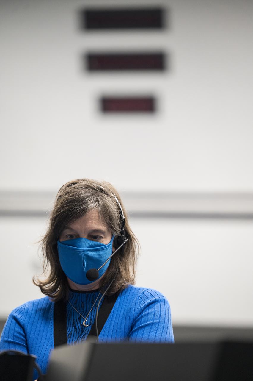 Holly Ridings, NASA’s chief flight director, monitors the countdown during a dress rehearsal in preparation for the launch of a SpaceX Falcon 9 rocket carrying the company's Crew Dragon spacecraft on NASA’s SpaceX Crew-3 mission with NASA astronauts Raja Chari, Tom Marshburn, Kayla Barron, and ESA (European Space Agency) astronaut Matthias Maurer onboard, Thursday, Oct. 28, 2021, in firing room four of the Launch Control Center at NASA’s Kennedy Space Center in Florida. NASA’s SpaceX Crew-3 mission is the third crew rotation mission of the SpaceX Crew Dragon spacecraft and Falcon 9 rocket to the International Space Station as part of the agency’s Commercial Crew Program. Chari, Marshburn, Barron, Maurer are scheduled to launch on Oct. 31 at 2:21 a.m. ET, from Launch Complex 39A at the Kennedy Space Center. Photo Credit: (NASA/Aubrey Gemignani)