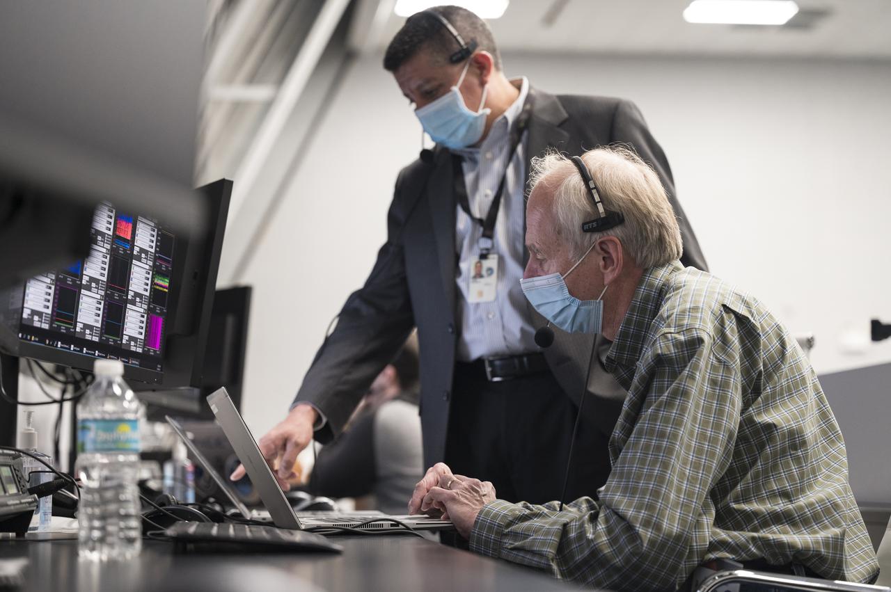 William Gerstenmaier, vice president for Build and Flight Reliability at SpaceX, left, and Richard Jones, manager of the Mission Management and Integration Office for NASA's Commercial Crew Program, monitor the countdown during a dress rehearsal in preparation for the launch of a SpaceX Falcon 9 rocket carrying the company's Crew Dragon spacecraft on NASA’s SpaceX Crew-3 mission with NASA astronauts Raja Chari, Tom Marshburn, Kayla Barron, and ESA (European Space Agency) astronaut Matthias Maurer onboard, Thursday, Oct. 28, 2021, in firing room four of the Launch Control Center at NASA’s Kennedy Space Center in Florida. NASA’s SpaceX Crew-3 mission is the third crew rotation mission of the SpaceX Crew Dragon spacecraft and Falcon 9 rocket to the International Space Station as part of the agency’s Commercial Crew Program. Chari, Marshburn, Barron, Maurer are scheduled to launch on Oct. 31 at 2:21 a.m. ET, from Launch Complex 39A at the Kennedy Space Center. Photo Credit: (NASA/Aubrey Gemignani)
