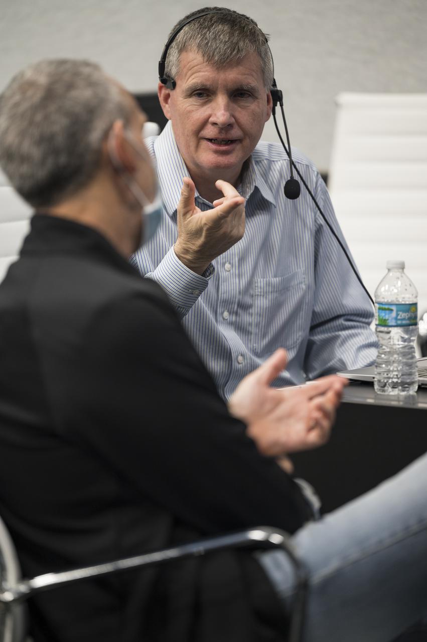 Steve Stich, manager of NASA’s Commercial Crew Program, right, speaks with Lee Rosen, SpaceX vice president of Mission and Launch Operations, during a dress rehearsal in preparation for the launch of a SpaceX Falcon 9 rocket carrying the company's Crew Dragon spacecraft on NASA’s SpaceX Crew-3 mission with NASA astronauts Raja Chari, Tom Marshburn, Kayla Barron, and ESA (European Space Agency) astronaut Matthias Maurer onboard, Thursday, Oct. 28, 2021, in firing room four of the Launch Control Center at NASA’s Kennedy Space Center in Florida. NASA’s SpaceX Crew-3 mission is the third crew rotation mission of the SpaceX Crew Dragon spacecraft and Falcon 9 rocket to the International Space Station as part of the agency’s Commercial Crew Program. Chari, Marshburn, Barron, Maurer are scheduled to launch on Oct. 31 at 2:21 a.m. ET, from Launch Complex 39A at the Kennedy Space Center. Photo Credit: (NASA/Aubrey Gemignani)