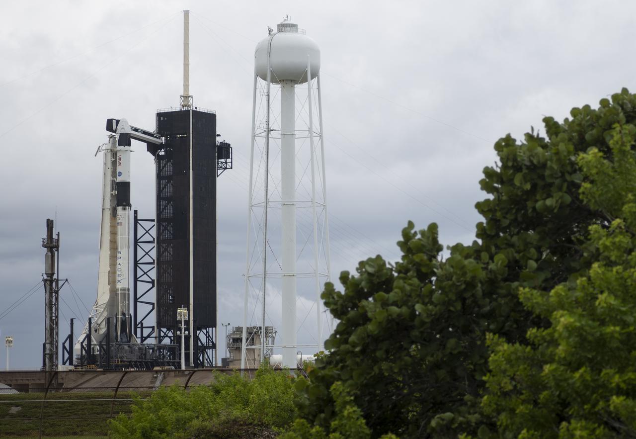 A SpaceX Falcon 9 rocket with the company's Crew Dragon spacecraft onboard is seen on the launch pad at Launch Complex 39A as preparations continue for the Crew-3 mission, Saturday, Oct. 30, 2021, at NASA’s Kennedy Space Center in Florida. NASA’s SpaceX Crew-3 mission is the third crew rotation mission of the SpaceX Crew Dragon spacecraft and Falcon 9 rocket to the International Space Station as part of the agency’s Commercial Crew Program. NASA astronauts Raja Chari, Tom Marshburn, Kayla Barron, and ESA (European Space Agency) astronaut Matthias Maurer are scheduled to launch on Nov. 3 at 1:10 a.m. ET, from Launch Complex 39A at the Kennedy Space Center. Photo Credit: (NASA/Joel Kowsky)