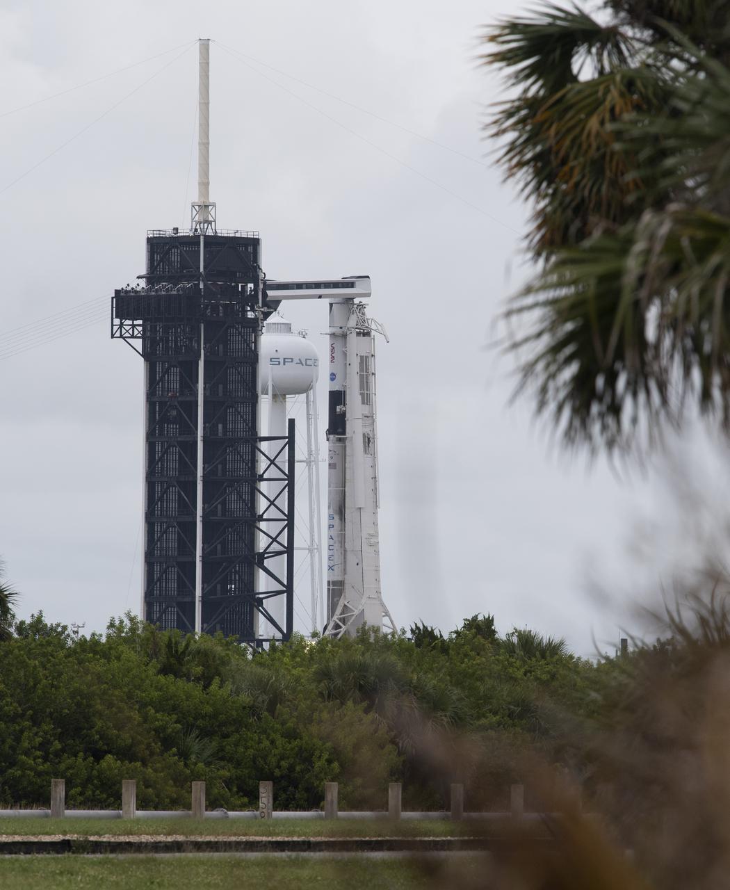 A SpaceX Falcon 9 rocket with the company's Crew Dragon spacecraft onboard is seen on the launch pad at Launch Complex 39A as preparations continue for the Crew-3 mission, Saturday, Oct. 30, 2021, at NASA’s Kennedy Space Center in Florida. NASA’s SpaceX Crew-3 mission is the third crew rotation mission of the SpaceX Crew Dragon spacecraft and Falcon 9 rocket to the International Space Station as part of the agency’s Commercial Crew Program. NASA astronauts Raja Chari, Tom Marshburn, Kayla Barron, and ESA (European Space Agency) astronaut Matthias Maurer are scheduled to launch on Nov. 3 at 1:10 a.m. ET, from Launch Complex 39A at the Kennedy Space Center. Photo Credit: (NASA/Joel Kowsky)