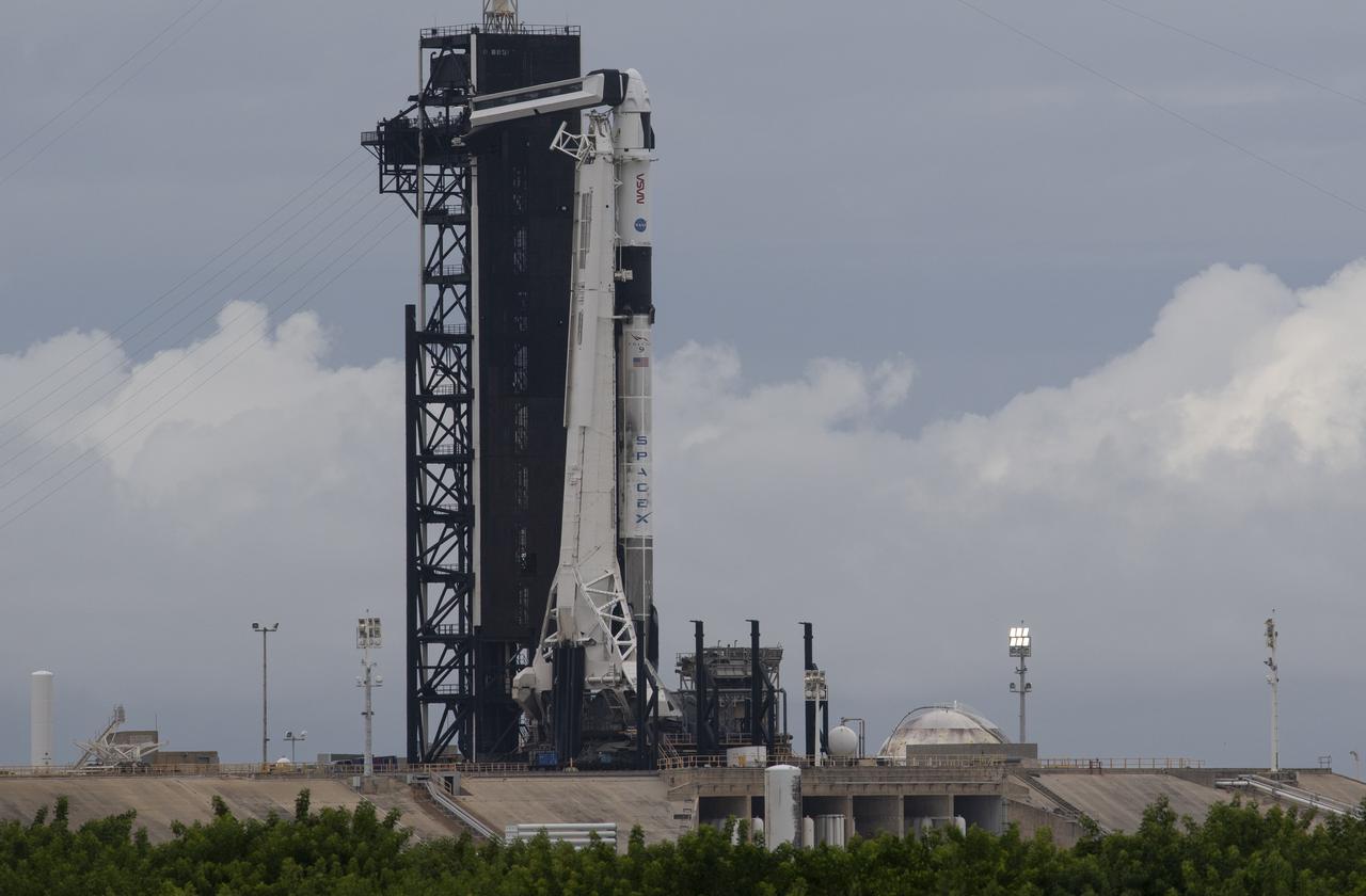 A SpaceX Falcon 9 rocket with the company's Crew Dragon spacecraft onboard is seen on the launch pad at Launch Complex 39A as preparations continue for the Crew-3 mission, Saturday, Oct. 30, 2021, at NASA’s Kennedy Space Center in Florida. NASA’s SpaceX Crew-3 mission is the third crew rotation mission of the SpaceX Crew Dragon spacecraft and Falcon 9 rocket to the International Space Station as part of the agency’s Commercial Crew Program. NASA astronauts Raja Chari, Tom Marshburn, Kayla Barron, and ESA (European Space Agency) astronaut Matthias Maurer are scheduled to launch on Nov. 3 at 1:10 a.m. ET, from Launch Complex 39A at the Kennedy Space Center. Photo Credit: (NASA/Joel Kowsky)