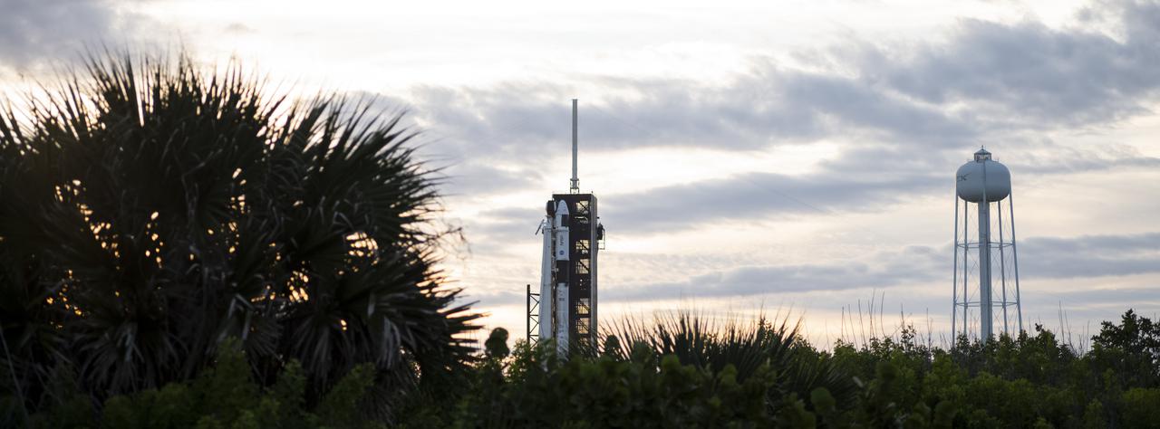 A SpaceX Falcon 9 rocket with the company's Crew Dragon spacecraft onboard is seen on the launch pad at Launch Complex 39A as preparations continue for the Crew-3 mission, Monday, Nov. 1, 2021, at NASA’s Kennedy Space Center in Florida. NASA’s SpaceX Crew-3 mission is the third crew rotation mission of the SpaceX Crew Dragon spacecraft and Falcon 9 rocket to the International Space Station as part of the agency’s Commercial Crew Program. NASA astronauts Raja Chari, Tom Marshburn, Kayla Barron, and ESA (European Space Agency) astronaut Matthias Maurer are scheduled to launch no earlier than Nov. 6 at 11:36 p.m. ET, from Launch Complex 39A at the Kennedy Space Center. Photo Credit: (NASA/Joel Kowsky)