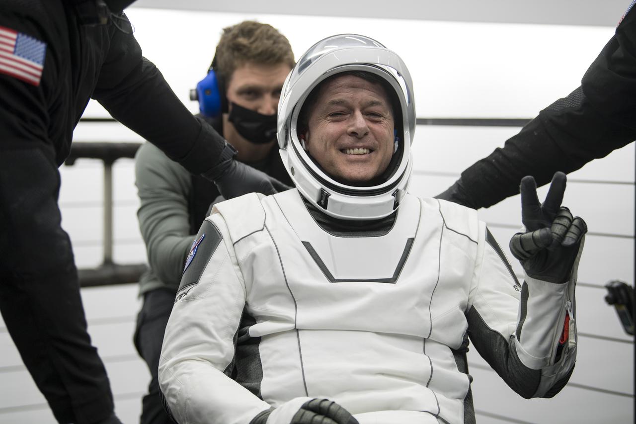NASA astronaut Shane Kimbrough gives a hand sign after he was helped out of the SpaceX Crew Dragon Endeavour spacecraft onboard the SpaceX GO Navigator recovery ship after he and NASA astronaut Megan McArthur, Japan Aerospace Exploration Agency (JAXA) astronaut Aki Hoshide, and ESA (European Space Agency) astronaut Thomas Pesquet landed in the Gulf of Mexico off the coast of Pensacola, Florida, Monday, Nov. 8, 2021. NASA’s SpaceX Crew-2 mission is the second operational mission of the SpaceX Crew Dragon spacecraft and Falcon 9 rocket to the International Space Station as part of the agency’s Commercial Crew Program. Photo Credit: (NASA/Aubrey Gemignani)