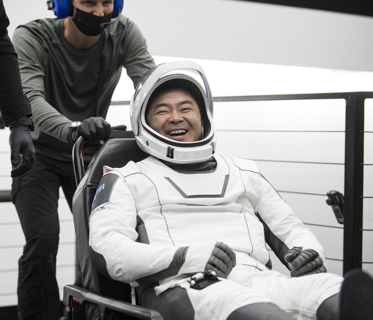 Japan Aerospace Exploration Agency (JAXA) astronaut Aki Hoshide reacts to a comment after being helped out of the SpaceX Crew Dragon Endeavour spacecraft onboard the SpaceX GO Navigator recovery ship after he and NASA astronauts Shane Kimbrough and Megan McArthur, and ESA (European Space Agency) astronaut Thomas Pesquet landed in the Gulf of Mexico off the coast of Pensacola, Florida, Monday, Nov. 8, 2021. NASA’s SpaceX Crew-2 mission is the second operational mission of the SpaceX Crew Dragon spacecraft and Falcon 9 rocket to the International Space Station as part of the agency’s Commercial Crew Program. Photo Credit: (NASA/Aubrey Gemignani)