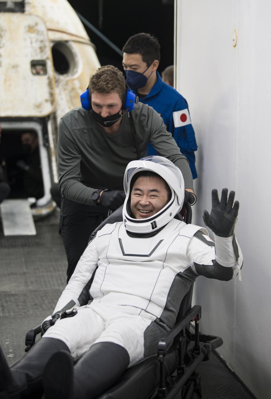Japan Aerospace Exploration Agency (JAXA) astronaut Aki Hoshide waves after being helped out of the SpaceX Crew Dragon Endeavour spacecraft onboard the SpaceX GO Navigator recovery ship after he and NASA astronauts Shane Kimbrough and Megan McArthur, and ESA (European Space Agency) astronaut Thomas Pesquet landed in the Gulf of Mexico off the coast of Pensacola, Florida, Monday, Nov. 8, 2021. NASA’s SpaceX Crew-2 mission is the second operational mission of the SpaceX Crew Dragon spacecraft and Falcon 9 rocket to the International Space Station as part of the agency’s Commercial Crew Program. Photo Credit: (NASA/Aubrey Gemignani)