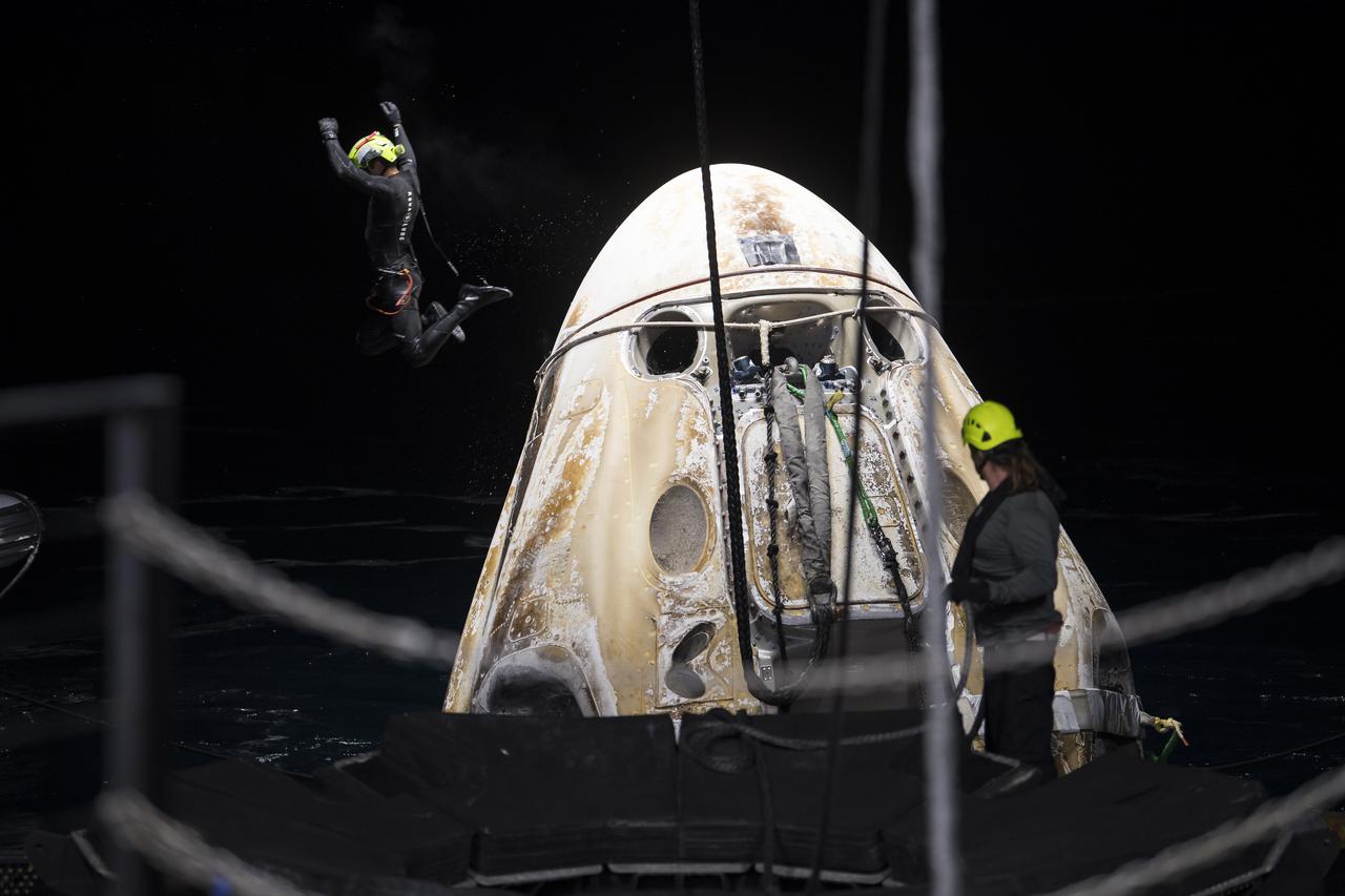 Support teams work around the SpaceX Crew Dragon Endeavour spacecraft shortly after it landed with NASA astronauts Shane Kimbrough and Megan McArthur, Japan Aerospace Exploration Agency (JAXA) astronaut Aki Hoshide, and ESA (European Space Agency) astronaut Thomas Pesquet aboard in the Gulf of Mexico off the coast of Pensacola, Florida, Monday, Nov. 8, 2021. NASA’s SpaceX Crew-2 mission is the second operational mission of the SpaceX Crew Dragon spacecraft and Falcon 9 rocket to the International Space Station as part of the agency’s Commercial Crew Program. Photo Credit: (NASA/Aubrey Gemignani)