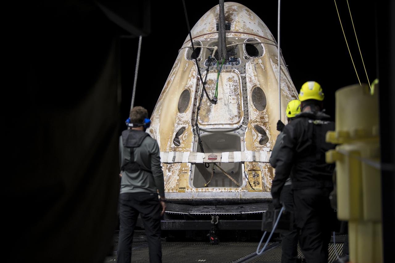 The SpaceX Crew Dragon Endeavour spacecraft is lifted onto the GO Navigator recovery ship after it landed with NASA astronauts Shane Kimbrough and Megan McArthur, Japan Aerospace Exploration Agency (JAXA) astronaut Aki Hoshide, and ESA (European Space Agency) astronaut Thomas Pesquet in the Gulf of Mexico off the coast of Pensacola, Florida, Monday, Nov. 8, 2021. NASA’s SpaceX Crew-2 mission is the second operational mission of the SpaceX Crew Dragon spacecraft and Falcon 9 rocket to the International Space Station as part of the agency’s Commercial Crew Program. Photo Credit: (NASA/Aubrey Gemignani)