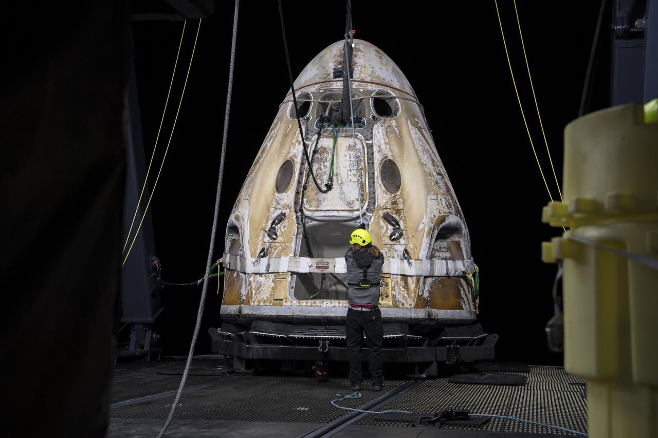 The SpaceX Crew Dragon Endeavour spacecraft is lifted onto the GO Navigator recovery ship after it landed with NASA astronauts Shane Kimbrough and Megan McArthur, Japan Aerospace Exploration Agency (JAXA) astronaut Aki Hoshide, and ESA (European Space Agency) astronaut Thomas Pesquet in the Gulf of Mexico off the coast of Pensacola, Florida, Monday, Nov. 8, 2021. NASA’s SpaceX Crew-2 mission is the second operational mission of the SpaceX Crew Dragon spacecraft and Falcon 9 rocket to the International Space Station as part of the agency’s Commercial Crew Program. Photo Credit: (NASA/Aubrey Gemignani)