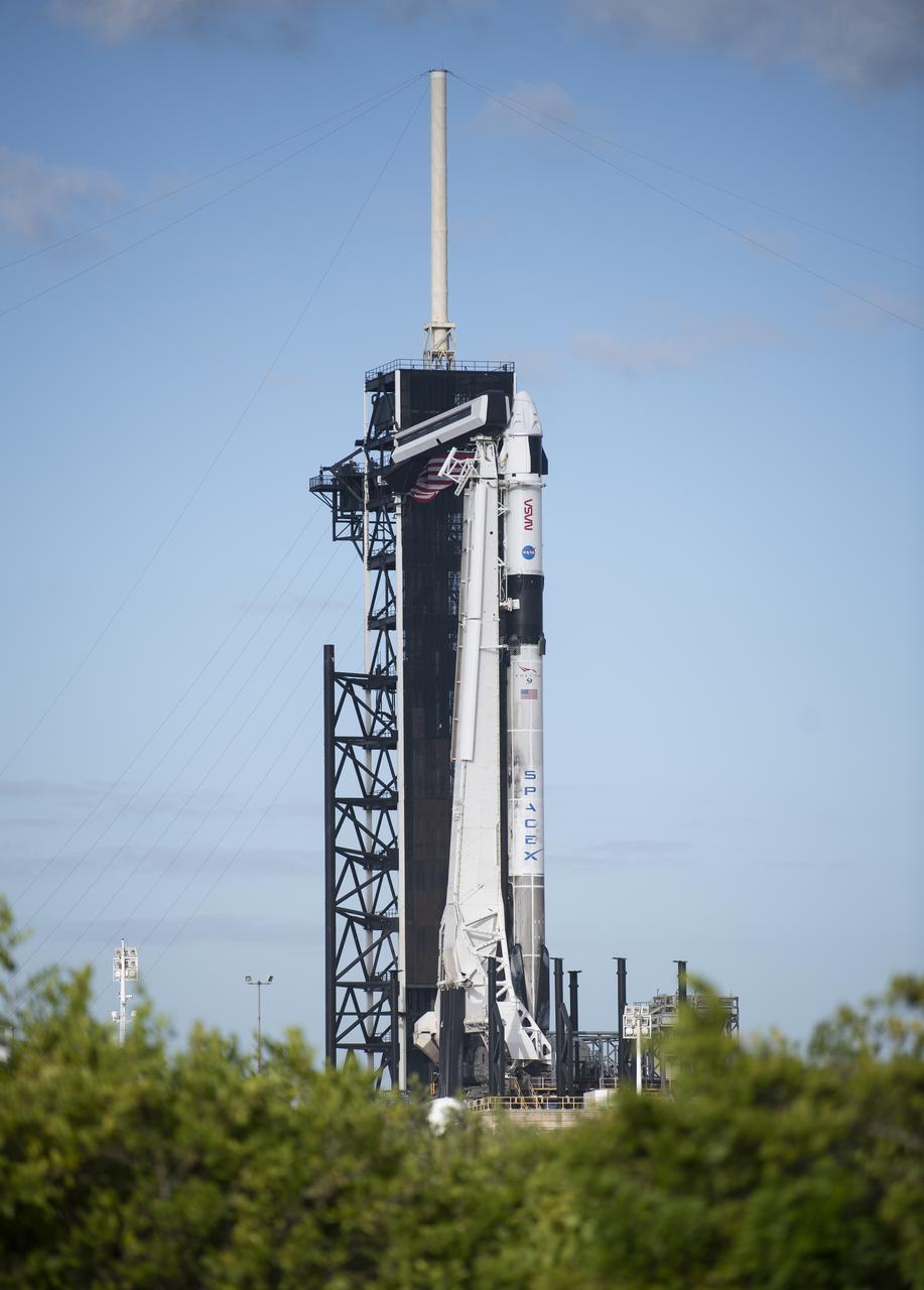 A SpaceX Falcon 9 rocket with the company's Crew Dragon spacecraft onboard is seen on the launch pad at Launch Complex 39A as preparations continue for the Crew-3 mission, Tuesday, Nov. 9, 2021, at NASA’s Kennedy Space Center in Florida. NASA’s SpaceX Crew-3 mission is the third crew rotation mission of the SpaceX Crew Dragon spacecraft and Falcon 9 rocket to the International Space Station as part of the agency’s Commercial Crew Program. NASA astronauts Raja Chari, Tom Marshburn, Kayla Barron, and ESA (European Space Agency) astronaut Matthias Maurer are scheduled to launch no earlier than Nov. 10 at 9:03 p.m. EST, from Launch Complex 39A at the Kennedy Space Center. Photo Credit: (NASA/Joel Kowsky)