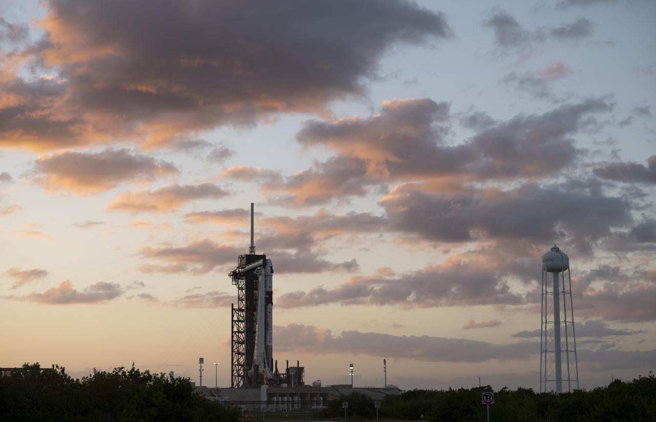 A SpaceX Falcon 9 rocket with the company's Crew Dragon spacecraft onboard is seen at sunset on the launch pad at Launch Complex 39A as preparations continue for the Crew-3 mission, Tuesday, Nov. 9, 2021, at NASA’s Kennedy Space Center in Florida. NASA’s SpaceX Crew-3 mission is the third crew rotation mission of the SpaceX Crew Dragon spacecraft and Falcon 9 rocket to the International Space Station as part of the agency’s Commercial Crew Program. NASA astronauts Raja Chari, Tom Marshburn, Kayla Barron, and ESA (European Space Agency) astronaut Matthias Maurer are scheduled to launch no earlier than Nov. 10 at 9:03 p.m. EST, from Launch Complex 39A at the Kennedy Space Center. Photo Credit: (NASA/Joel Kowsky)