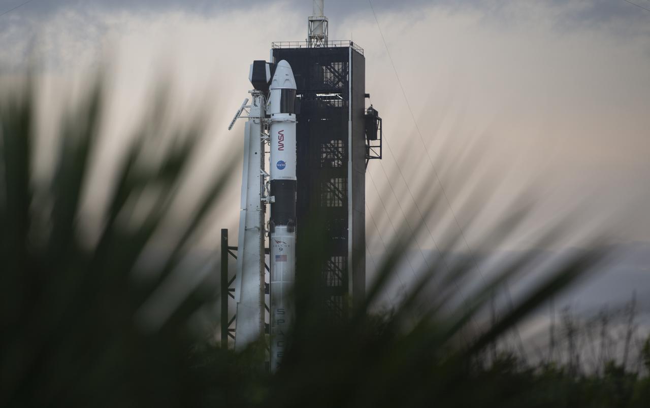 A SpaceX Falcon 9 rocket with the company's Crew Dragon spacecraft onboard is seen at sunrise on the launch pad at Launch Complex 39A as preparations continue for the Crew-3 mission, Wednesday, Nov. 10, 2021, at NASA’s Kennedy Space Center in Florida. NASA’s SpaceX Crew-3 mission is the third crew rotation mission of the SpaceX Crew Dragon spacecraft and Falcon 9 rocket to the International Space Station as part of the agency’s Commercial Crew Program. NASA astronauts Raja Chari, Tom Marshburn, Kayla Barron, and ESA (European Space Agency) astronaut Matthias Maurer are scheduled to launch at 9:03 p.m. EST, from Launch Complex 39A at the Kennedy Space Center. Photo Credit: (NASA/Joel Kowsky)