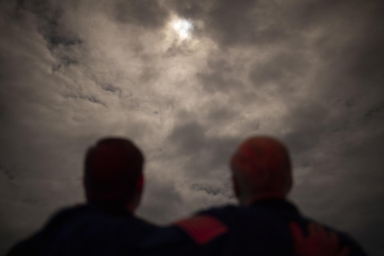NASA Administrator Bill Nelson, right, and his son Bill Nelson Jr., left, watch the launch of a SpaceX Falcon 9 rocket carrying the company's Crew Dragon spacecraft on NASA’s SpaceX Crew-3 mission with NASA astronauts Raja Chari, Tom Marshburn, Kayla Barron, and ESA (European Space Agency) astronaut Matthias Maurer onboard, Wednesday, Nov. 10, 2021, from the balcony of Operations Support Building II at NASA’s Kennedy Space Center in Florida. NASA’s SpaceX Crew-3 mission is the third crew rotation mission of the SpaceX Crew Dragon spacecraft and Falcon 9 rocket to the International Space Station as part of the agency’s Commercial Crew Program. Chari, Marshburn, Barron, Maurer launched at 9:03 p.m. EST from Launch Complex 39A at the Kennedy Space Center to begin a six month mission onboard the orbital outpost. Photo Credit: (NASA/Joel Kowsky)