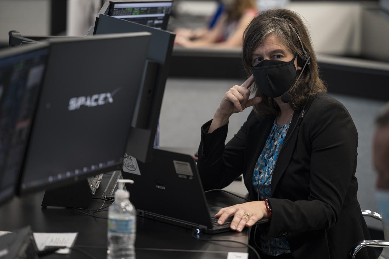 Holly Ridings, NASA's chief flight director, monitors the countdown of the launch of a SpaceX Falcon 9 rocket carrying the company's Crew Dragon spacecraft on NASA’s SpaceX Crew-3 mission with NASA astronauts Raja Chari, Tom Marshburn, Kayla Barron, and ESA (European Space Agency) astronaut Matthias Maurer onboard, Wednesday, Nov. 10, 2021, in firing room four of the Launch Control Center at NASA’s Kennedy Space Center in Florida. NASA’s SpaceX Crew-3 mission is the first crew rotation mission of the SpaceX Crew Dragon spacecraft and Falcon 9 rocket to the International Space Station as part of the agency’s Commercial Crew Program. Chari, Marshburn, Barron, Maurer are scheduled to launch at 9:03 p.m. EST, from Launch Complex 39A at the Kennedy Space Center. Photo Credit: (NASA/Aubrey Gemignani)